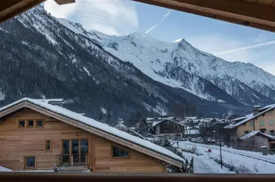 a view of a snow covered mountain from a cabin at Chalet Yolo - Chalet Retreat in Central Chamonix Steam Room in Chamonix-Mont-Blanc