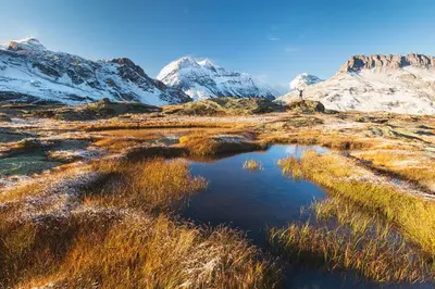 a small pond in the middle of a snowy mountain at Apartment Lognan 6 Centre Chamonix Mont Blanc in Chamonix-Mont-Blanc