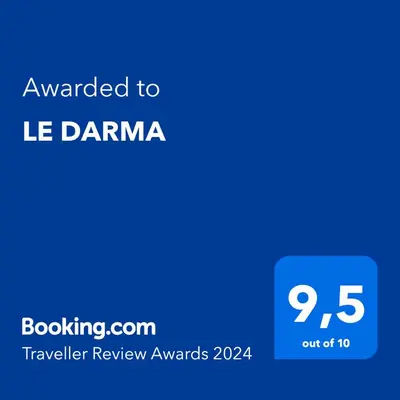 a kitchen with wooden cabinets and a microwave at LE DARMA in Sixt