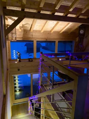 an inside view of a room with a staircase in a house at LE DARMA in Sixt