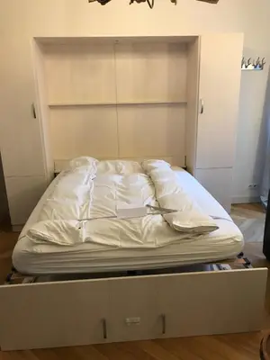 a bed on a platform in a room at Marie Paradis Studio Apt 15 in Chamonix-Mont-Blanc