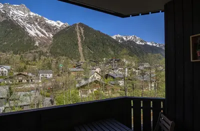 a view of a mountain range from a window at Apartment Grepon 3A - A Central Chamonix Haven in Chamonix-Mont-Blanc