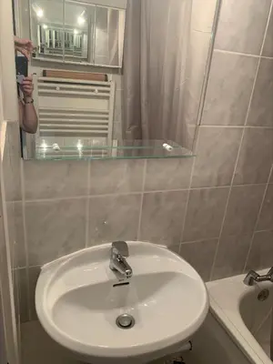 a bathroom with a sink and a mirror at Les Cimes in Samoëns