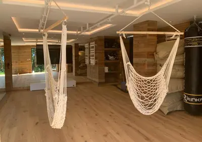 two hammocks hanging from the ceiling in a room at Chalet Les Meuniers in Megève