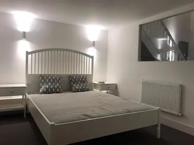 a bedroom with a large bed with two pillows at Le Mont Joly in Saint-Gervais-les-Bains