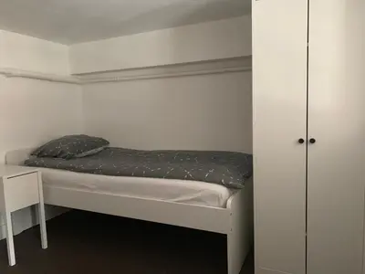 a small bedroom with a bed and a closet at Le Mont Joly in Saint-Gervais-les-Bains
