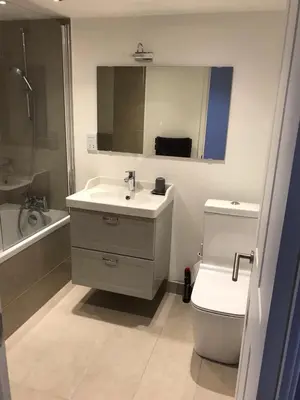 a bathroom with a sink and a toilet and a mirror at Le Mont Joly in Saint-Gervais-les-Bains