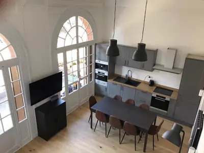 a kitchen with a table and chairs in a room at Le Mont Joly in Saint-Gervais-les-Bains