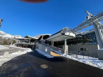 a building with a crane in the snow at Appartement T2+cabine indépendante au départ des télécabines Saint-Gervais/Bettex/Mont d’Arbois in Saint-Gervais-les-Bains