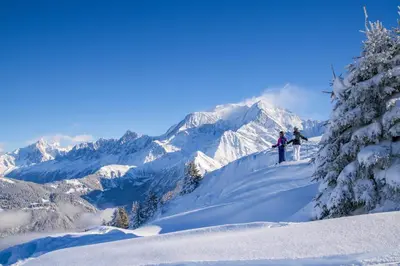 two people standing on top of a snow covered mountain at Appartement T2+cabine indépendante au départ des télécabines Saint-Gervais/Bettex/Mont d’Arbois in Saint-Gervais-les-Bains