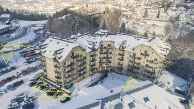 an aerial view of a hotel in the snow at Appartement T2+cabine indépendante au départ des télécabines Saint-Gervais/Bettex/Mont d’Arbois in Saint-Gervais-les-Bains