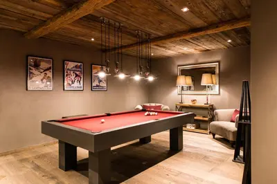 a billiard room with a red pool table at Chalet Seren in Chamonix-Mont-Blanc