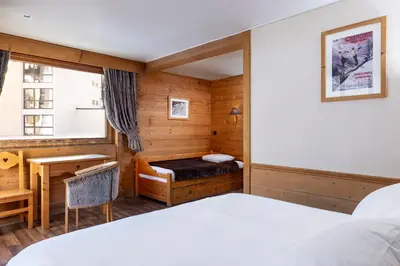a living room with a couch and a coffee table at Hôtel de L'Arve by HappyCulture in Chamonix-Mont-Blanc
