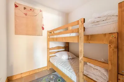 a bunk bed room with two bunk beds at Appartement 3 pièces 6 pers proche pistes - maeva Home - 3 Pièces 6 Personnes Sélection MAE-4880 in Arâches-la-Frasse
