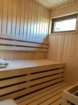 a sauna with a bench and a window at CHALET ALBA in Chamonix-Mont-Blanc
