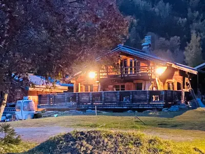 a house on fire with a train in front of it at CHALET ALBA in Chamonix-Mont-Blanc