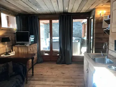 a room with a kitchen with a sink and a window at CHALET ALBA in Chamonix-Mont-Blanc
