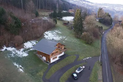 a log cabin with snow on the roof at Le Caribou in Saint-Gervais-les-Bains