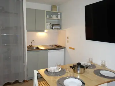 a kitchen with a table with two plates on it at Apartment La piste A by Interhome in Saint-Gervais-les-Bains