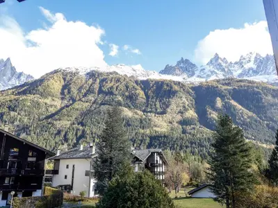a view of a mountain range with a house at Apartment Champraz-15 by Interhome in Chamonix-Mont-Blanc