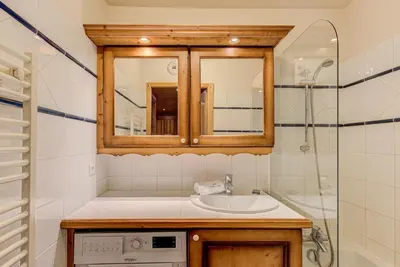 a bathroom with a sink and a shower at APARTMENT KANDAHAR - Alpes Travel - Central Chamonix - Sleeps 4 in Les Houches