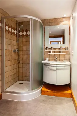 a bathroom with a shower and a sink at Appartement Le Galetas des Planards in Chamonix-Mont-Blanc