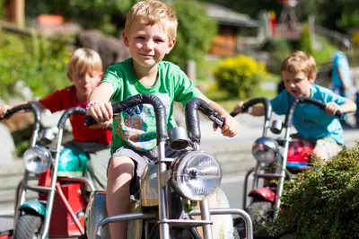 a group of children riding on motorcycles at Appartement Le Mazot Vue Mont Blanc in Chamonix-Mont-Blanc