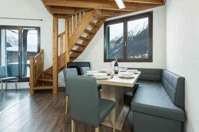 a dining room with a table and chairs at Apartment Balme 5 - Chamonix Mont Blanc in Chamonix-Mont-Blanc