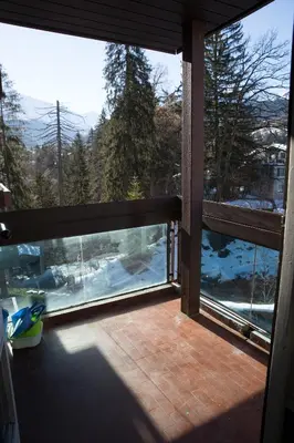 a screened in porch with a view of the snow at Castel des roches Leal Julien in Saint-Gervais-les-Bains
