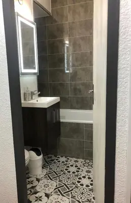 a bathroom with a shower and a sink and a toilet at La Comtesse in Saint-Gervais-les-Bains