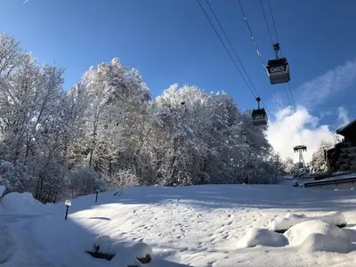 a snow covered ski slope with a ski lift at La Comtesse in Saint-Gervais-les-Bains