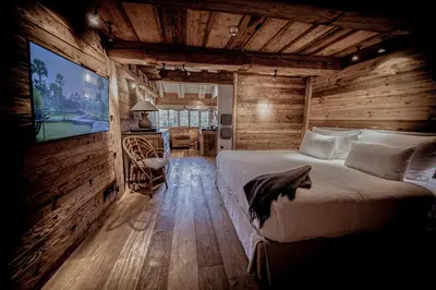 a bedroom with a large bed in a log cabin at Zannier Le Chalet in Megève