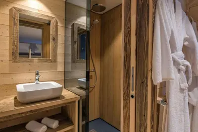 a bathroom with a white sink and a shower at Chalet De Praz Dru in Les Houches