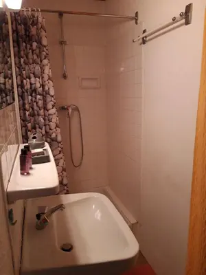a bathroom with a sink and a shower at Crêmerie Balmat in Chamonix-Mont-Blanc