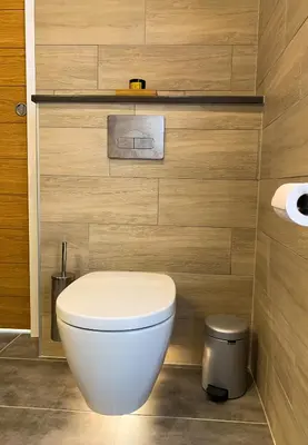 a bathroom with a white toilet in a room at Apartment Maya, La Praz, Chamonix Mont Blanc in Chamonix-Mont-Blanc
