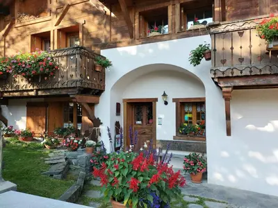 a building with flowers in front of it at le Montagny in Les Houches