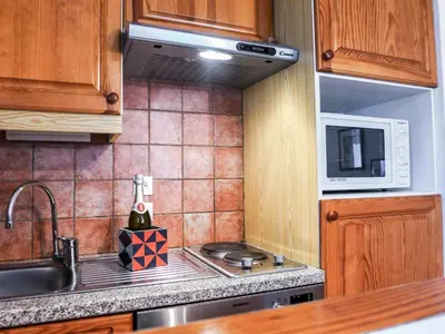 a kitchen with a sink and a microwave at Apartment L'Espace Montagne-5 by Interhome in Chamonix-Mont-Blanc