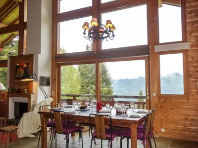 a large wooden table with plates and glasses on it at Chalet L'Epachat by Interhome in Mémontel