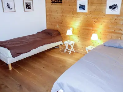 a bathroom with two sinks and a large mirror at Chalet L'Epachat by Interhome in Mémontel