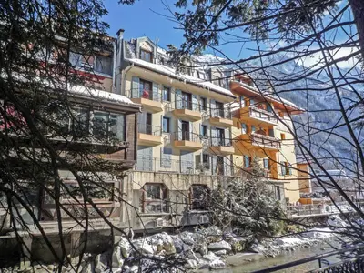 a group of buildings in front of a mountain at Apartment l'Armancette by Interhome in Chamonix-Mont-Blanc