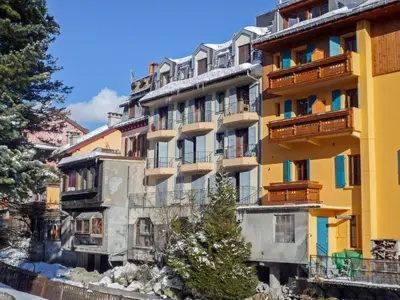 an apartment building with a mountain in the background at Apartment l'Armancette by Interhome in Chamonix-Mont-Blanc