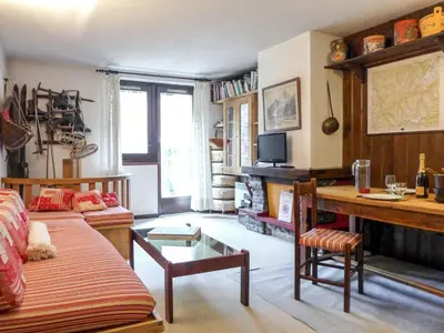 a living room with a couch and a table at Apartment Champraz-7 by Interhome in Chamonix-Mont-Blanc