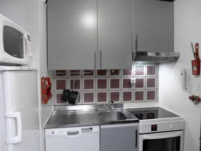 a small kitchen with a sink and a microwave at Apartment Champraz-7 by Interhome in Chamonix-Mont-Blanc