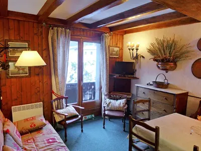 a room with a table and chairs and a window at Apartment Les Charmoz-3 by Interhome in Chamonix-Mont-Blanc