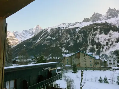 a view of a snow covered mountain from a train at Apartment Les Charmoz-3 by Interhome in Chamonix-Mont-Blanc