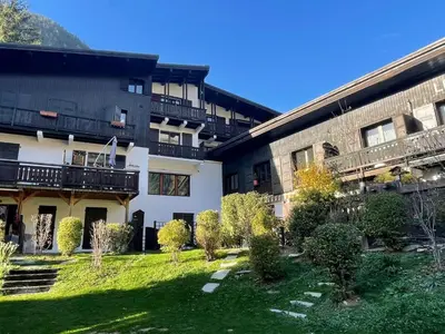 a building with a yard in front of it at Apartment Les Charmoz-3 by Interhome in Chamonix-Mont-Blanc