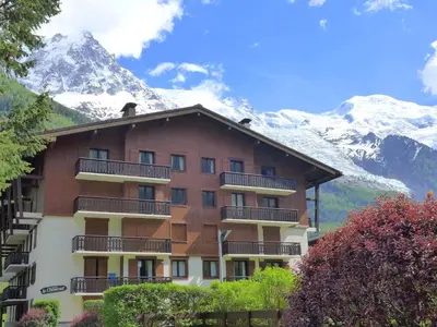 a living room with a couch and a table at Apartment Le Choucas by Interhome in Chamonix-Mont-Blanc