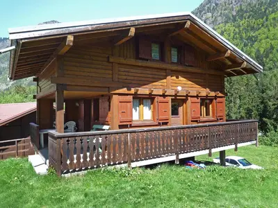 a log cabin with snow on the roof at Chalet Pierre Blanche by Interhome in Servoz
