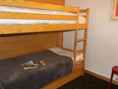 a bedroom with two bunk beds in a room at Apartment Grand Roc-3 by Interhome in Chamonix-Mont-Blanc