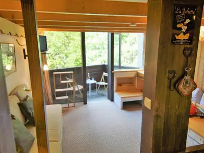 a living room with a view of a living room with a room at Apartment Grand Roc-3 by Interhome in Chamonix-Mont-Blanc